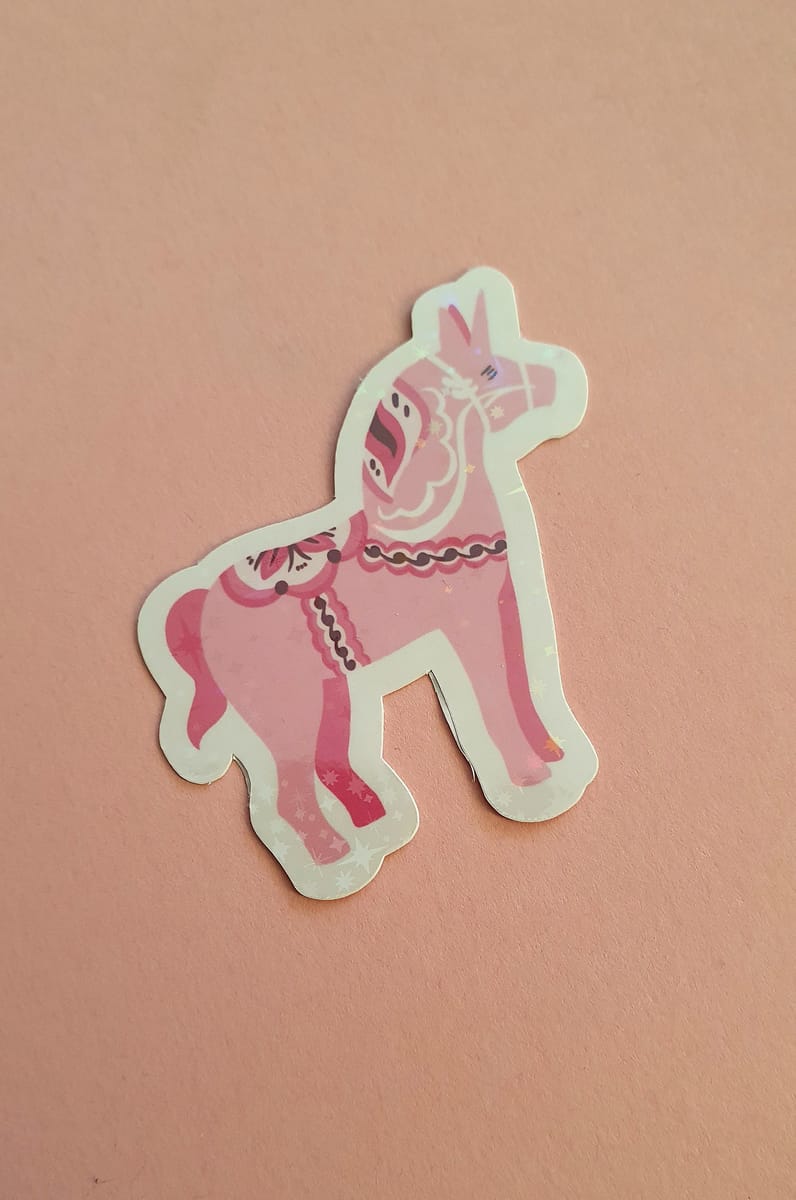 Klicker märke med rosa dala enhörning, laminerat med stjärnor