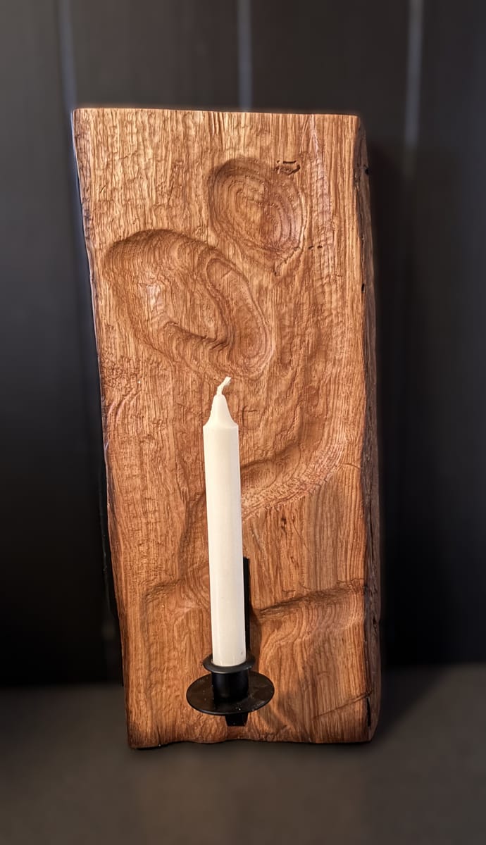 Väggdekoration med ljushållare