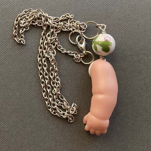 Halsband av återbruk – dockarm