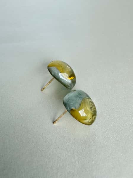 Light sage green and gold stud earrings with hypoallergenic steel posts