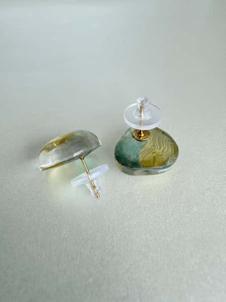 Light sage green and gold stud earrings with hypoallergenic steel posts