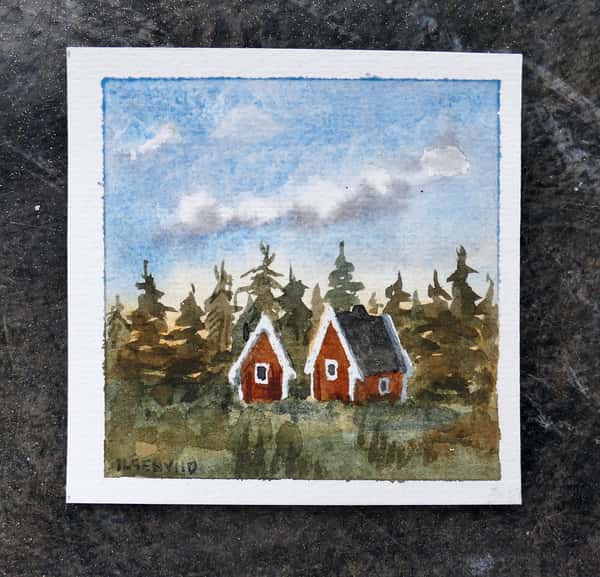 Liten original akvarellmålning. Röda stugor i skogen.