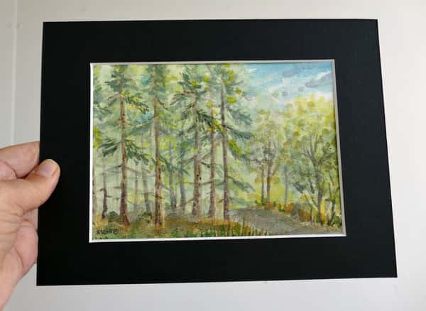 Akvarell original i svart passepartout. Skogsgläntan