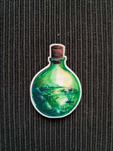 Glasflaska trädgårdsdamm